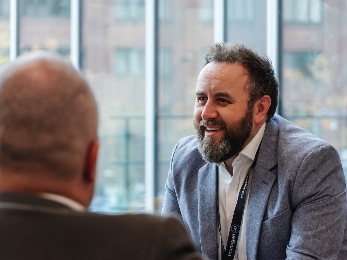Managed247 account manager in conversation with a UK customer about their managed IT support